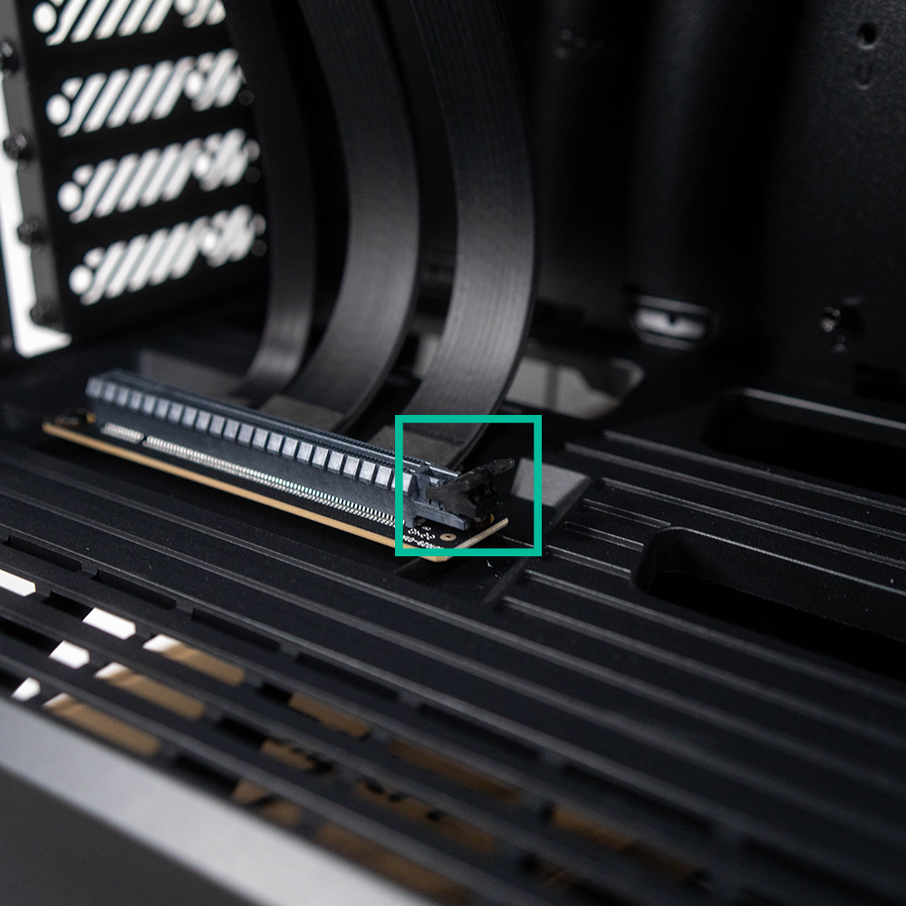 image showing GPU latch: small tab on the outside edge of riser cable